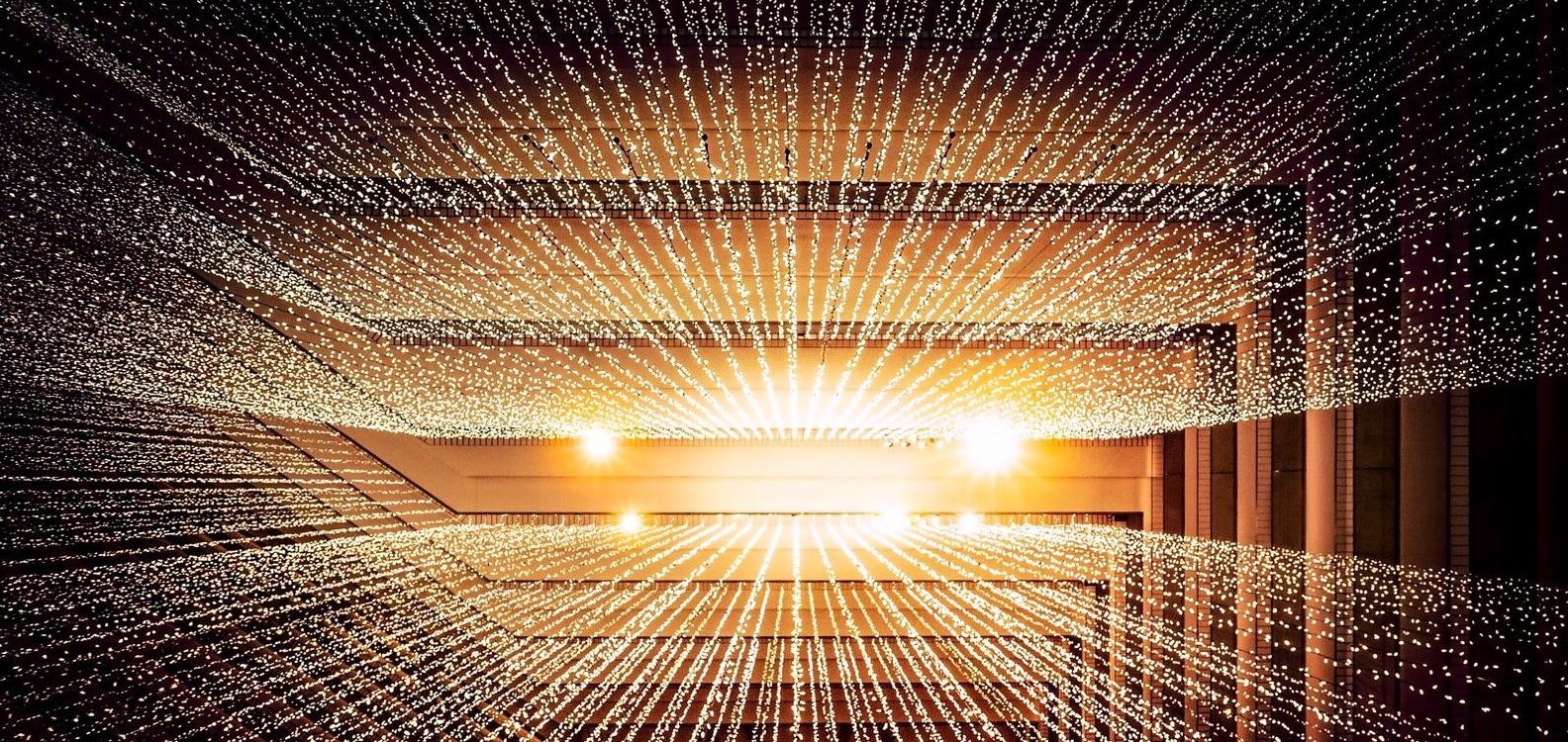 Artificial Intelligence depicted as numerous light points emanating from bright central light