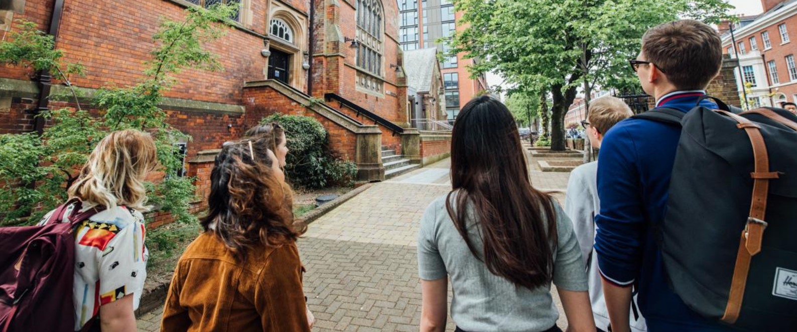 Zoom Dinner for Pathway Opportunity Programme Group of six students outside the School of Music at Queen's considering the best pathway to take
