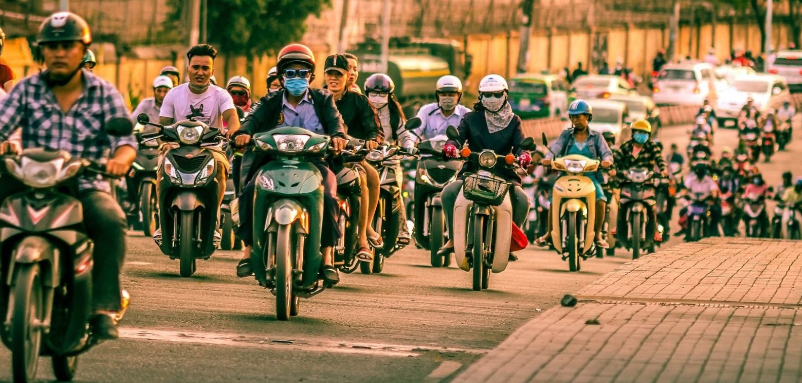 Multiple motorcycles on a busy road