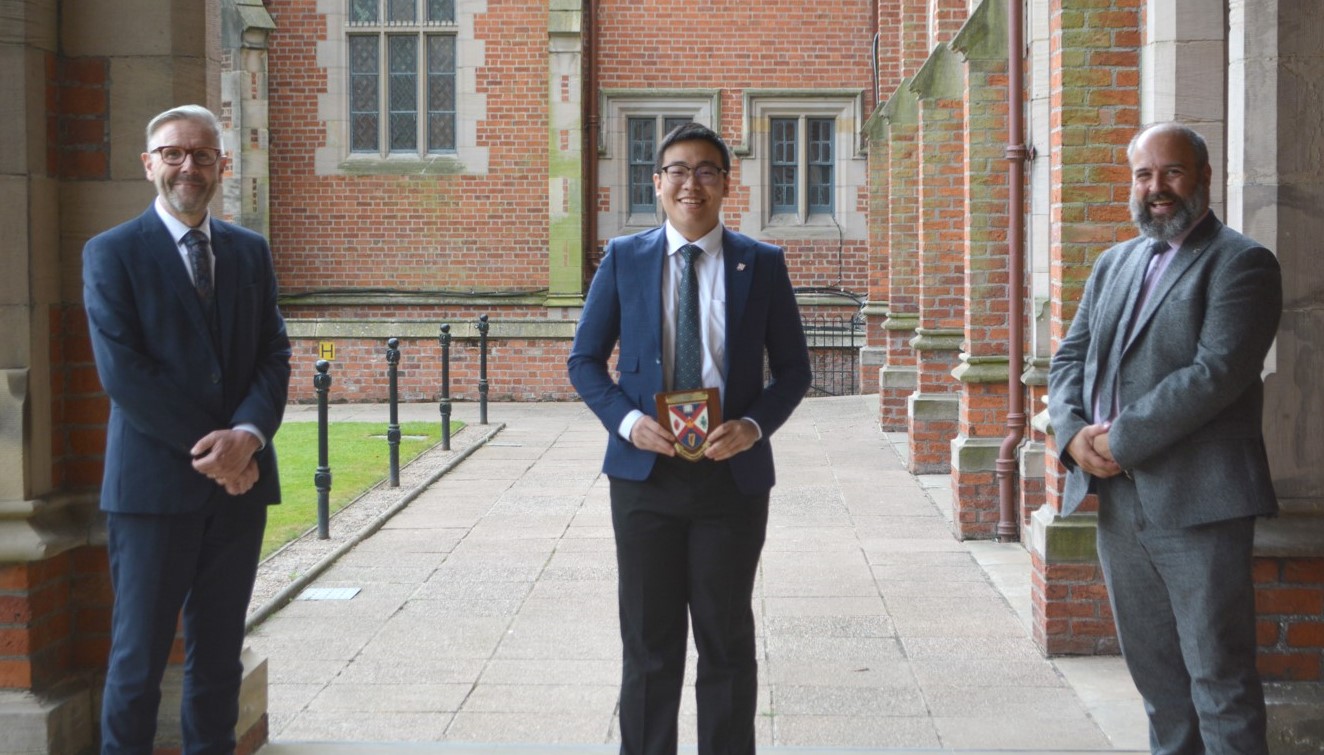 Student of the Year 2021 Professor David Jones, Student of the Year 2021 Yi Kang Choo and Ian Moore in cloisters at Queen's